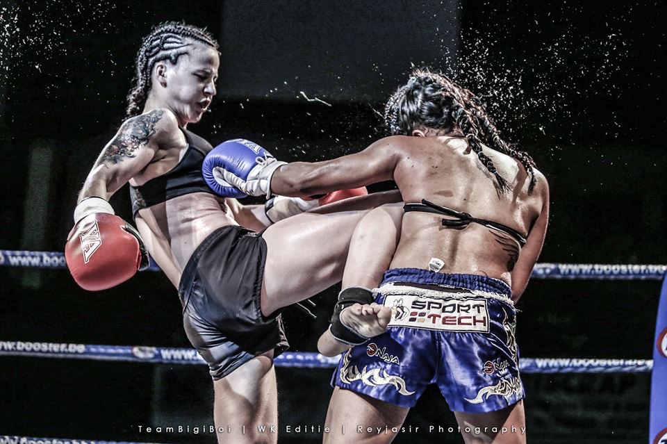 Marija kicking her opponent during a fight