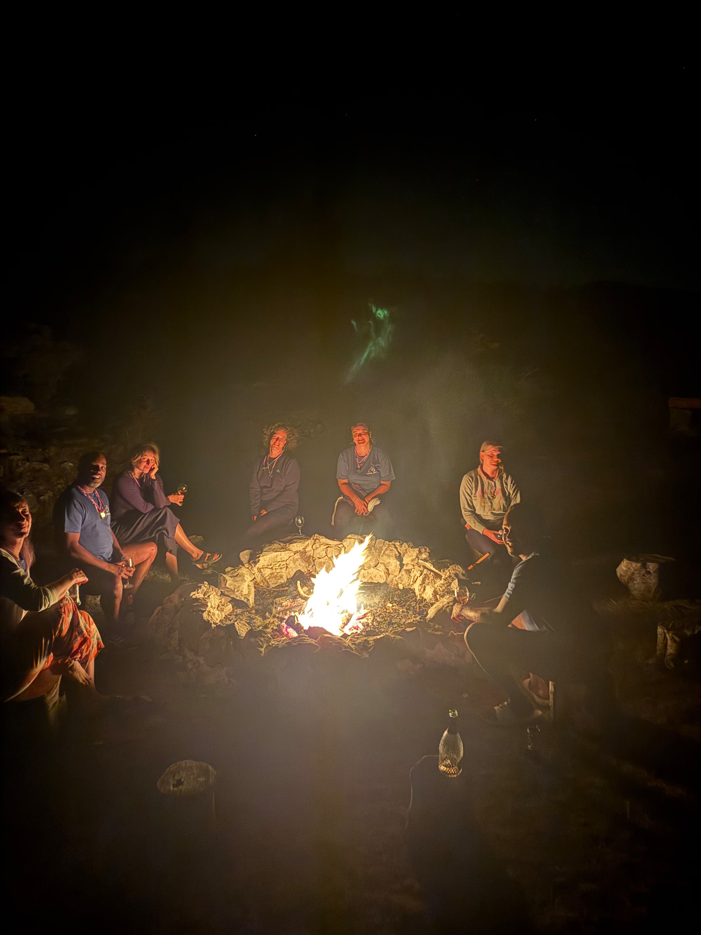 The tribe around the fire at night